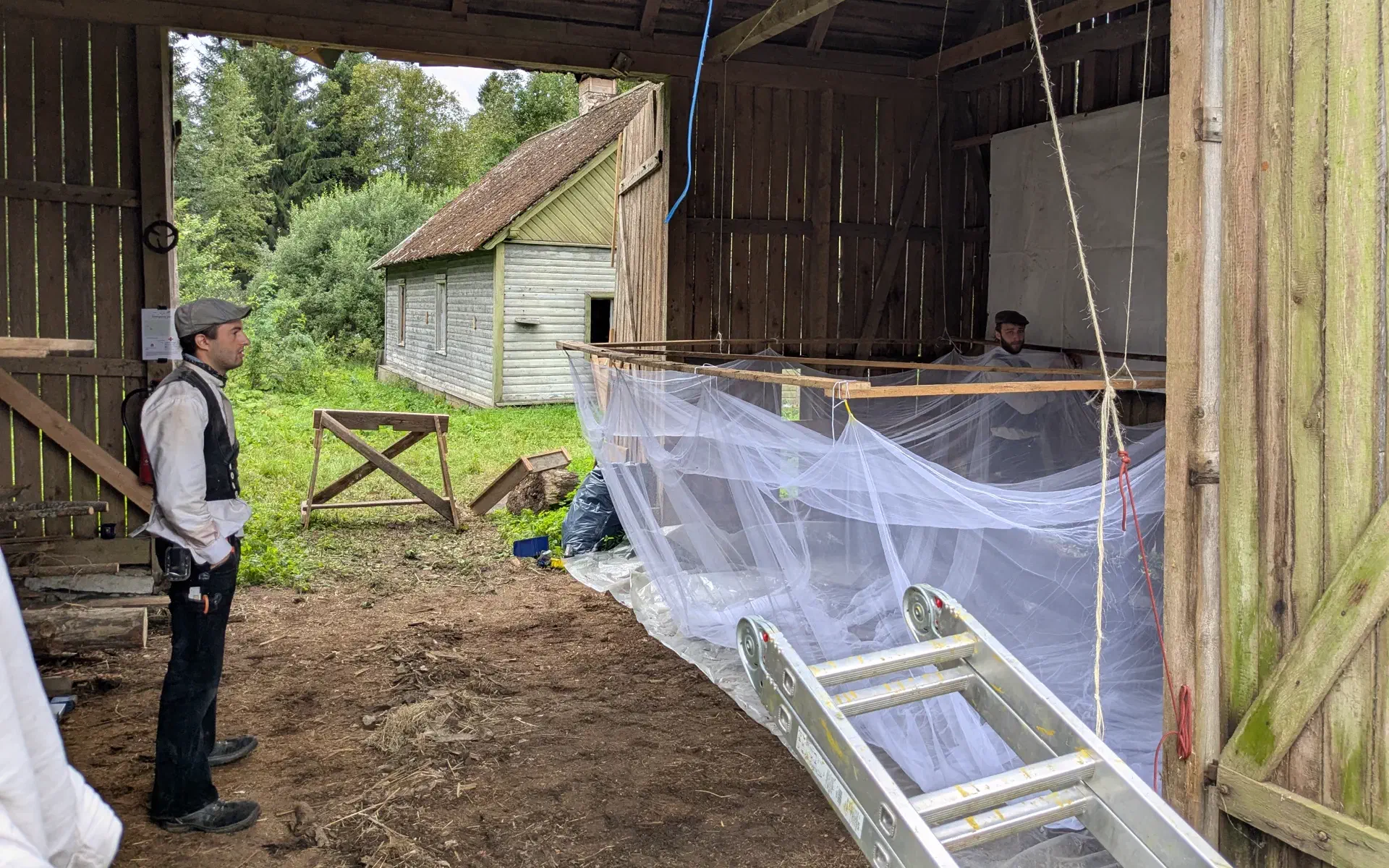 Paul prepares the mosquito net