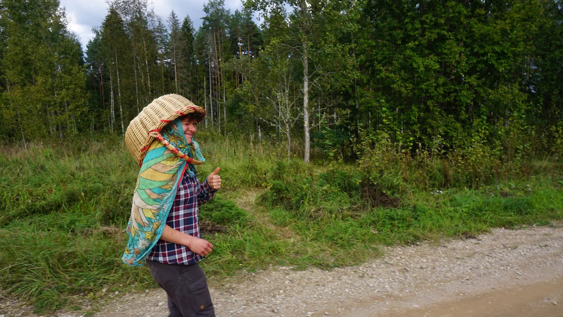 Lola goes mushroom hunting. She has a long scarf around her neck and a woven basket on her head to protect her from deer lice. Looks a little unconventional