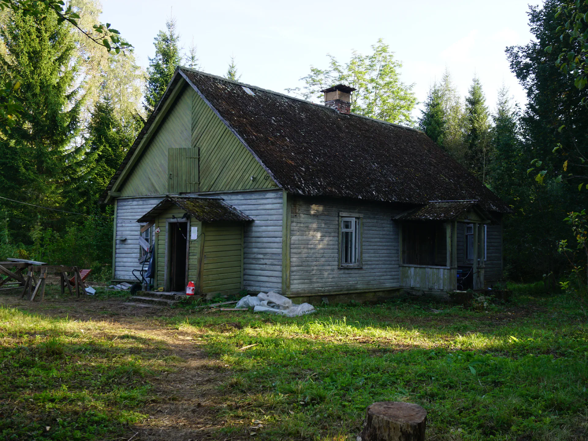 The chimney of the main house now has a small wooden roof