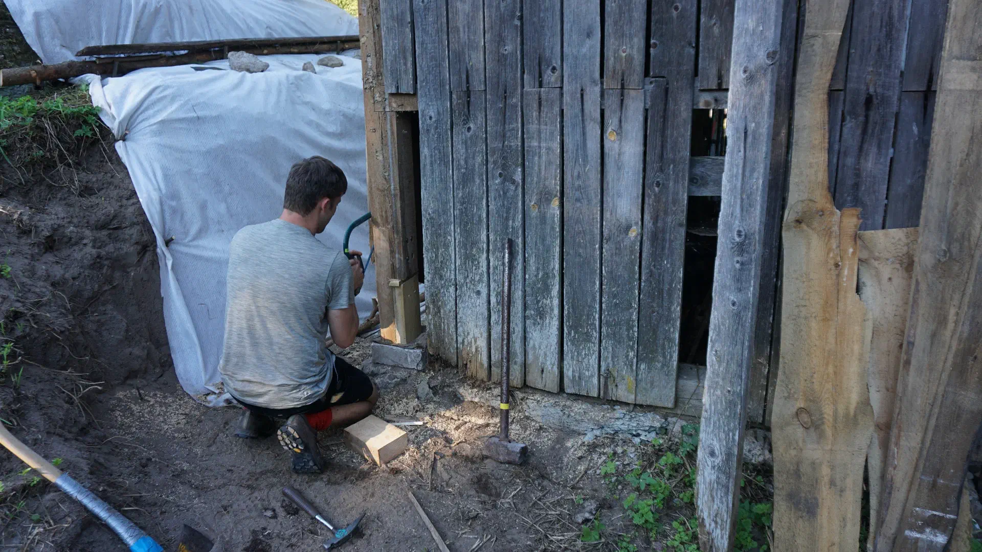 Tobi has patched up a broken beam at the corner of the barn