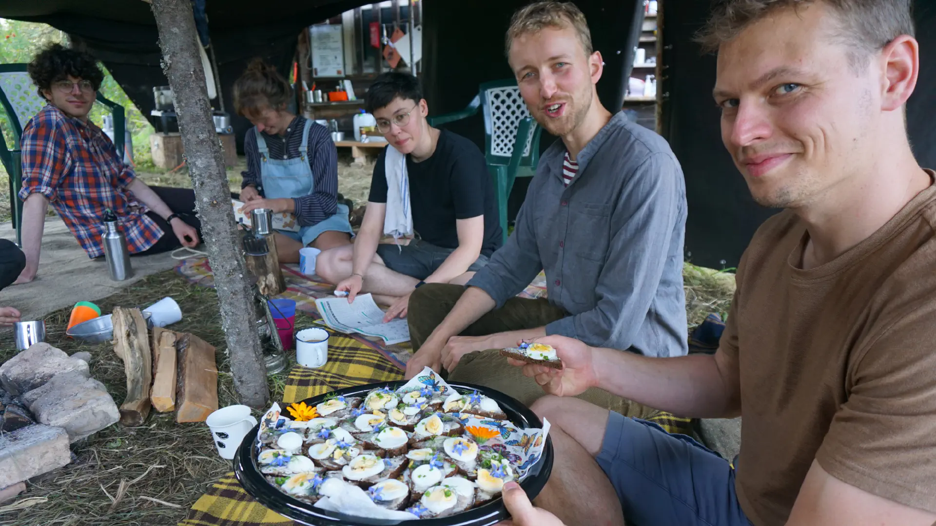 Hagen looks somewhat skeptically at a slab of sprat bread. Klaas is pleased