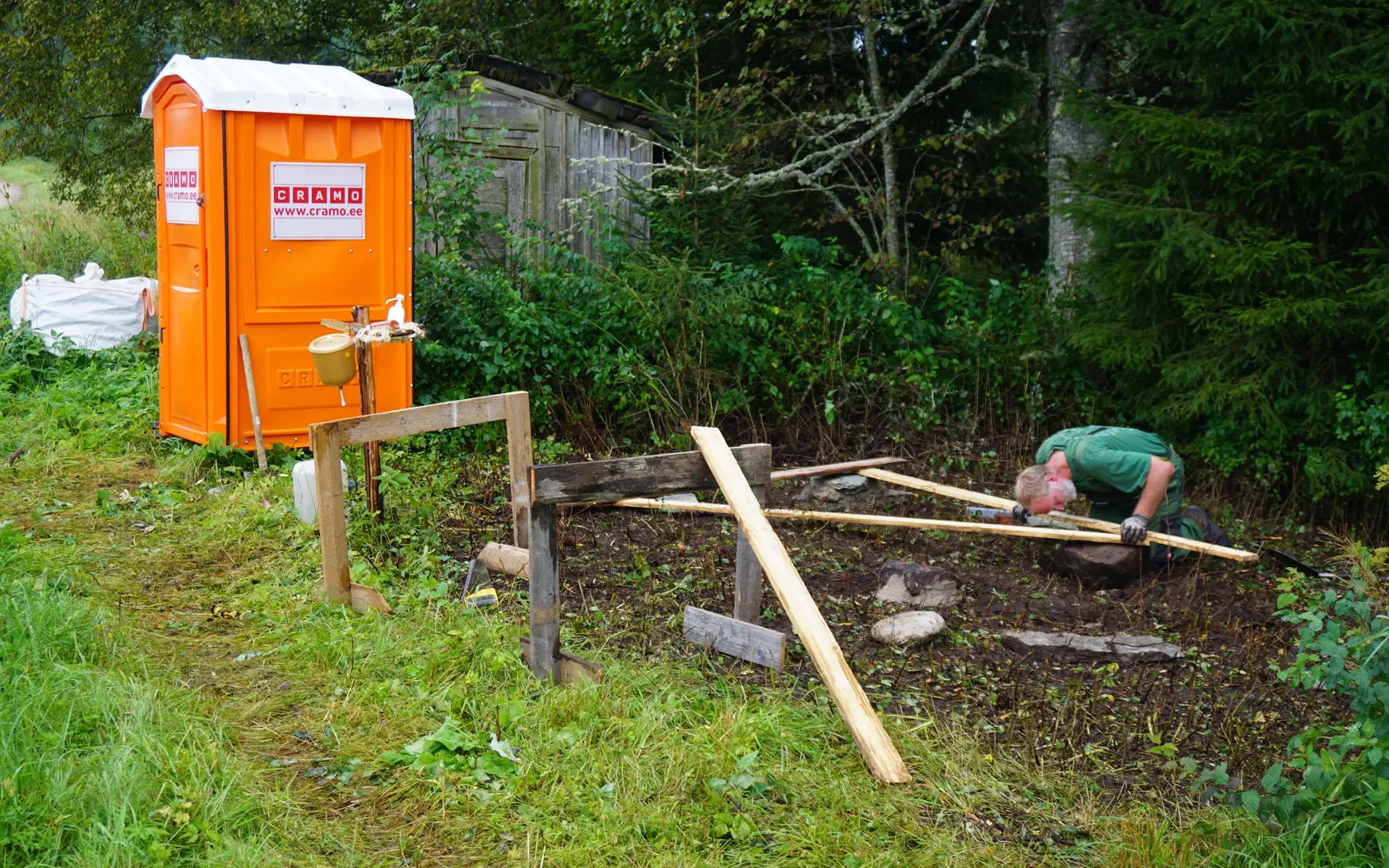 Tobias is building the foundation for the new toilet house