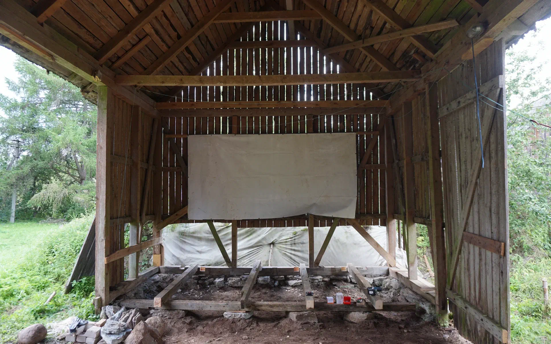 Additional beams have been added to the barn, creating a stable framework for the stage.