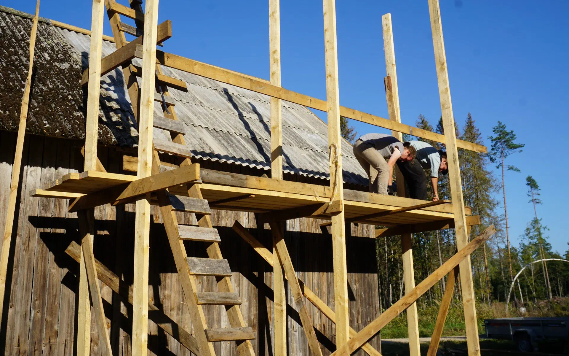 The wooden scaffolding on the barn before dismantling