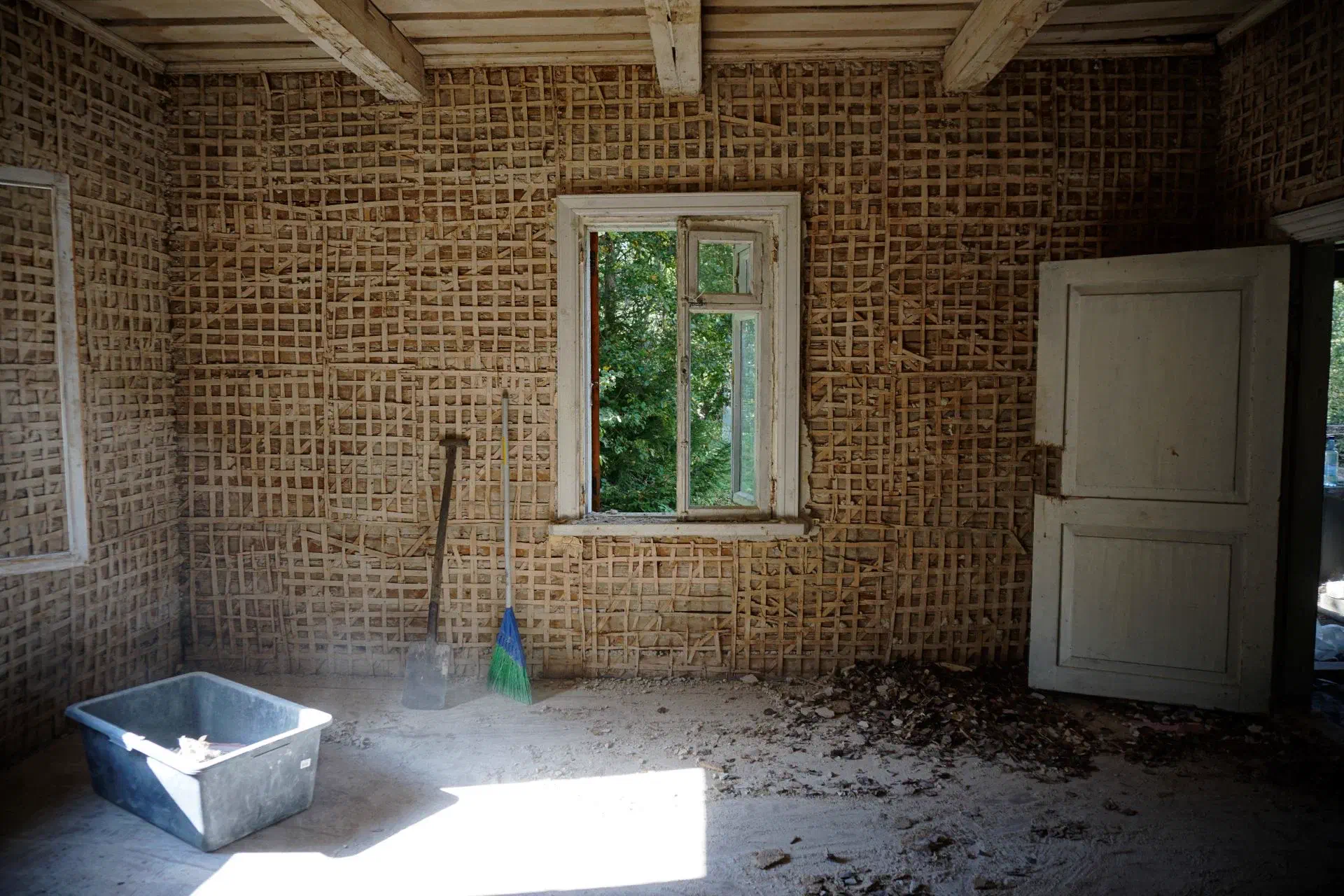 A room completely stripped of plaster