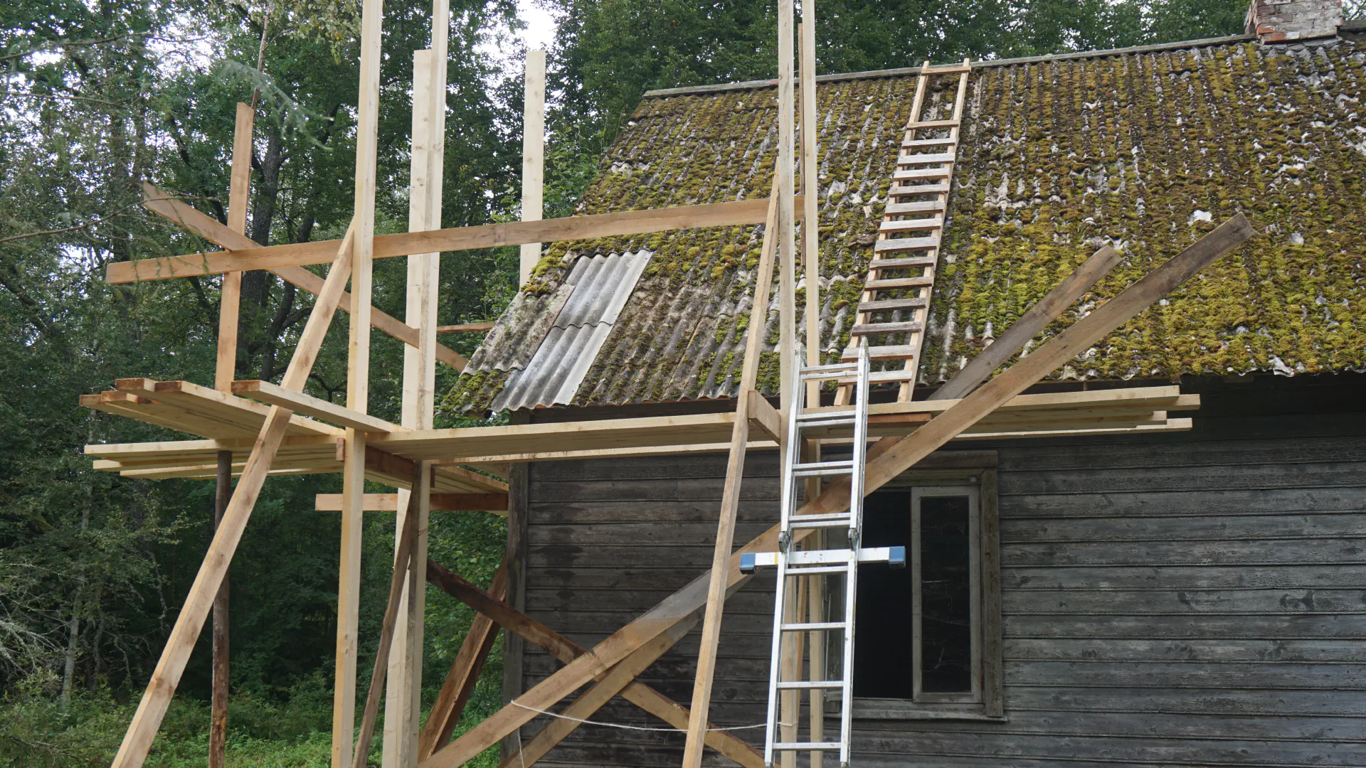 The repaired roof is finished with two new, gray panels