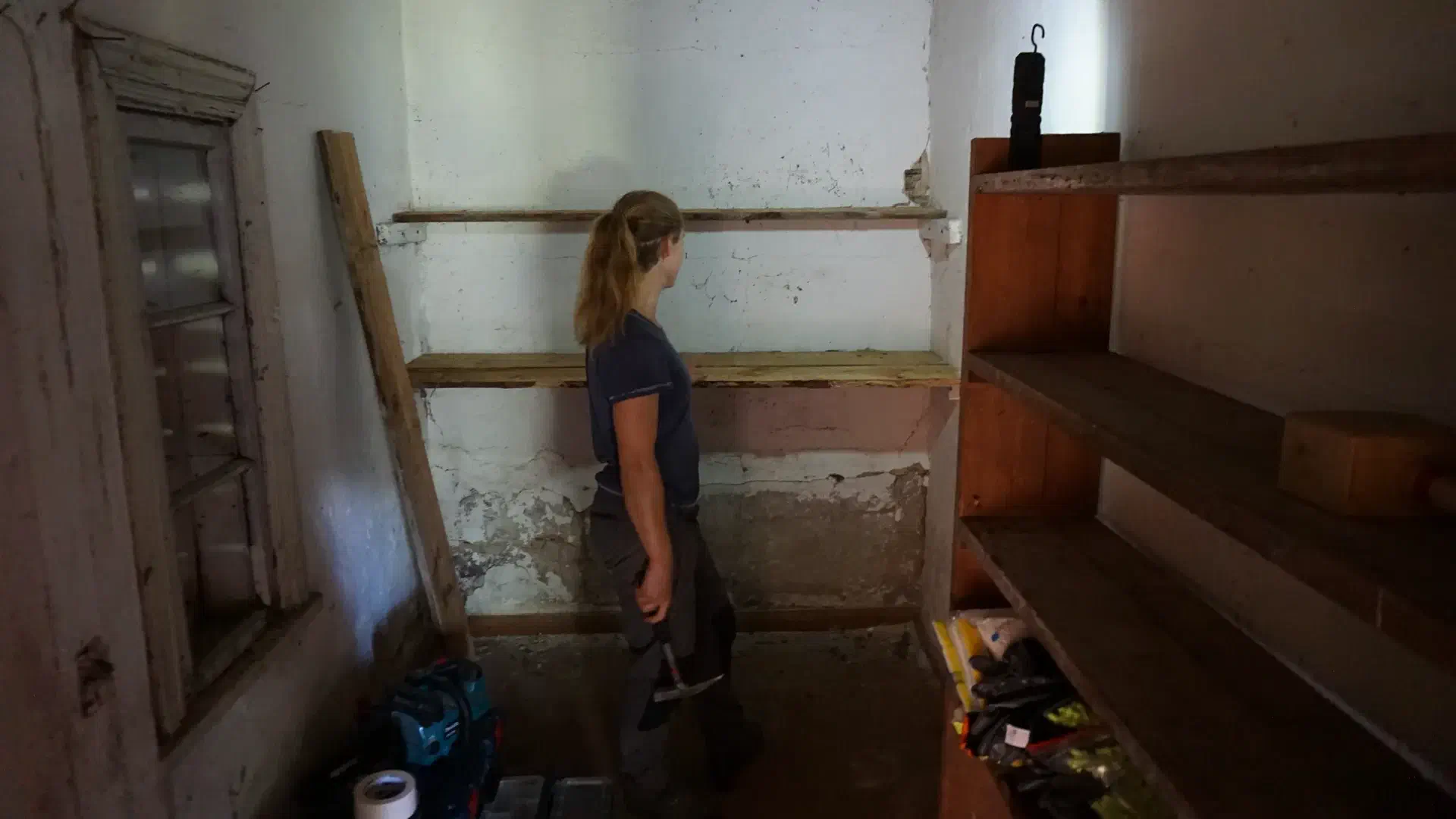 Petra looks proudly at her shelf