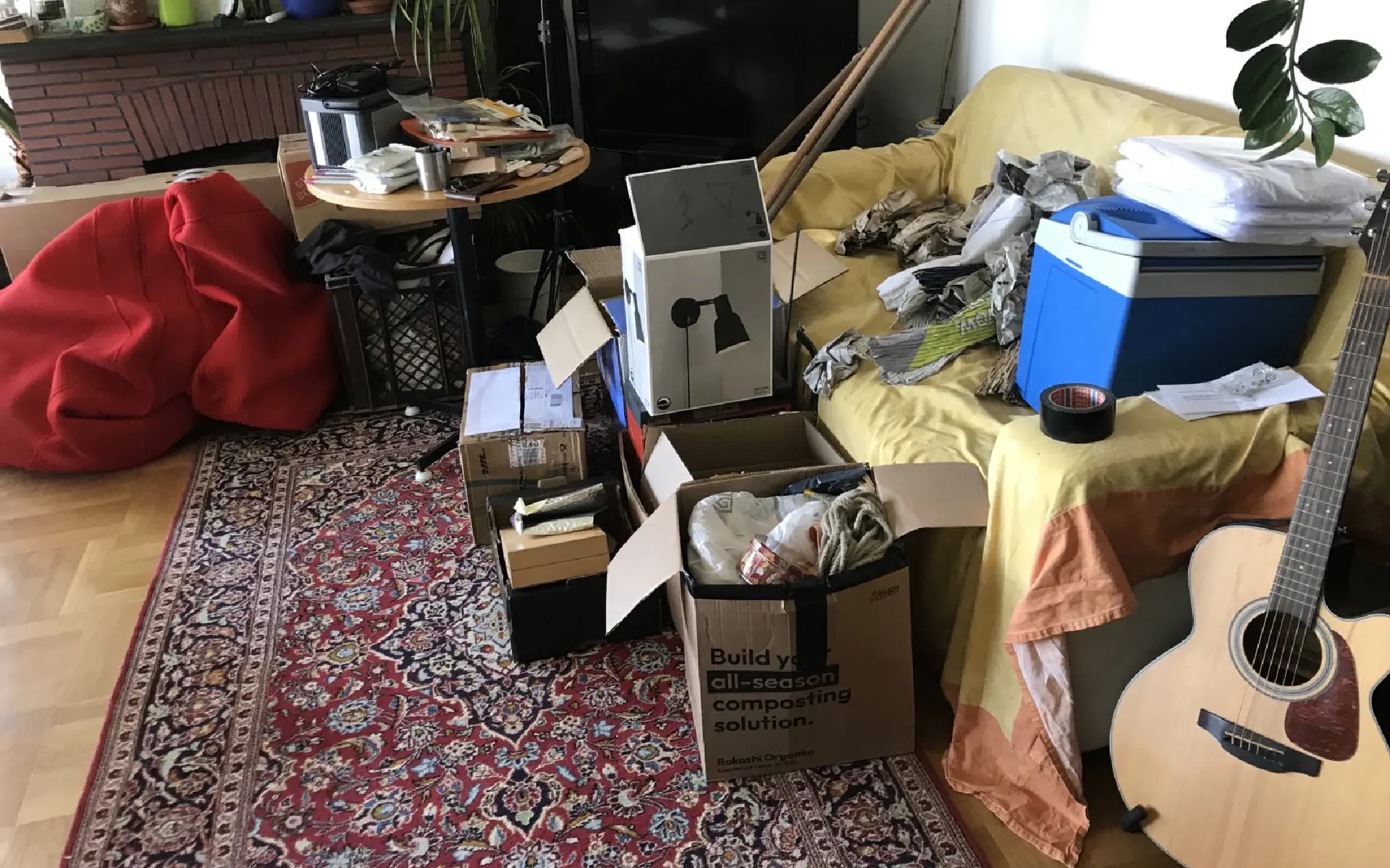 The whole sofa is covered with stuff and packages.