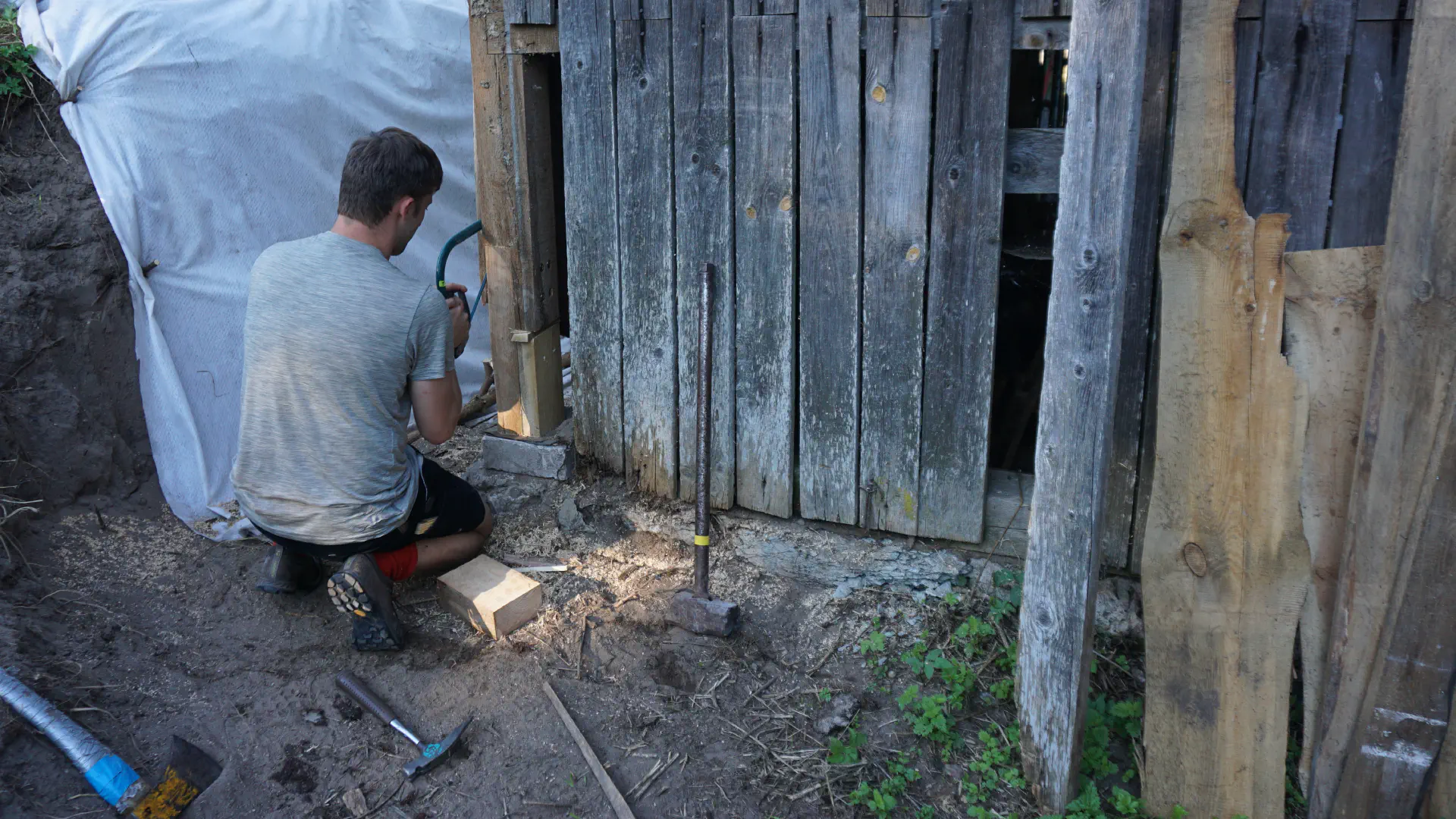 Tobi has patched up a broken beam at the corner of the barn