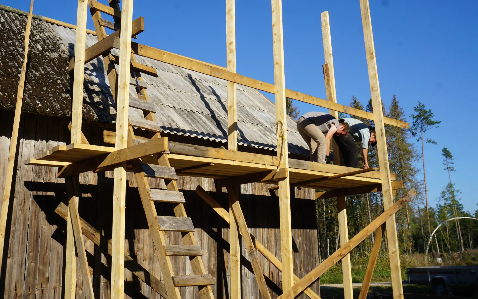 The wooden scaffolding on the barn before dismantling