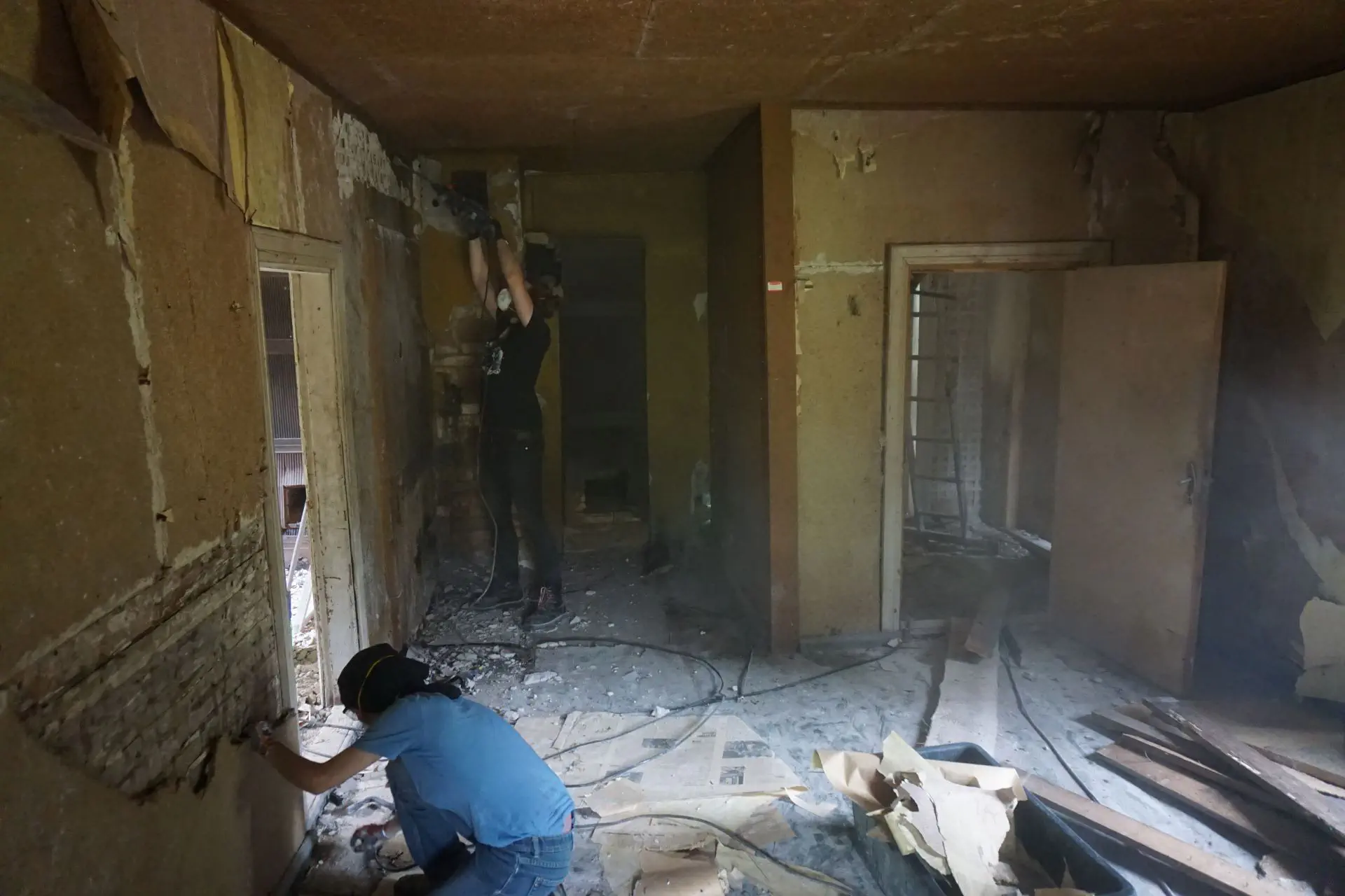 Plaster is being knocked off in the hallway of the main house. Quite dusty!